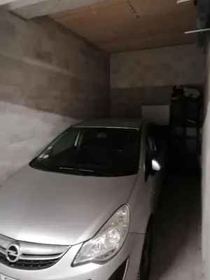 a white car parked in a garage at City Vibes, Indoor Parking, Breakfast & Air Conditioning in Nice