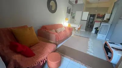a living room with a couch and a chair at Appartement au centre de Nice in Nice