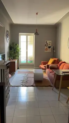 a living room with a couch and a table at Appartement au centre de Nice in Nice