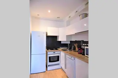 a kitchen with white appliances and a white refrigerator at 2 spacious bedrooms near Riquier station! in Nice