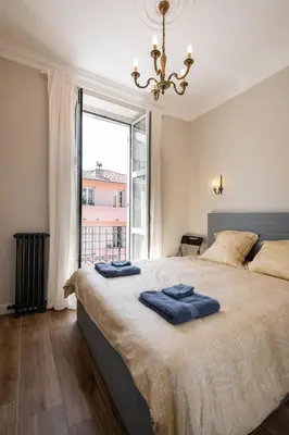 a bedroom with a large bed with a large window at 