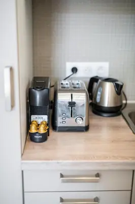 a kitchen counter with a coffee maker and a toaster at 