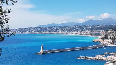 a view of a large body of water with a lighthouse at 