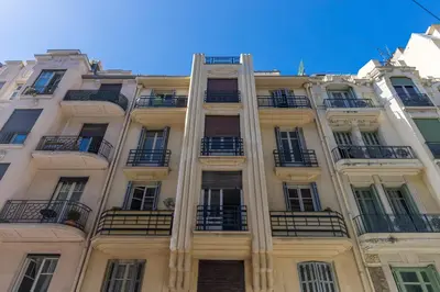 a tall building with balconies on the side of it at Open Sky Terrace Downtown Studio in Nice