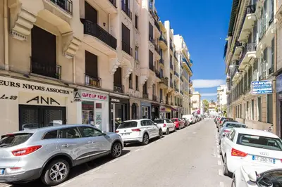a row of cars parked on a city street at Open Sky Terrace Downtown Studio in Nice
