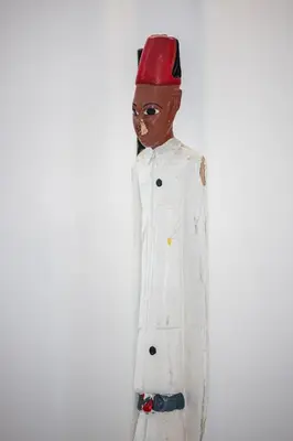 a mannequin wearing a white coat and a red hat at FEEL HOME - GRIMALDI in Nice
