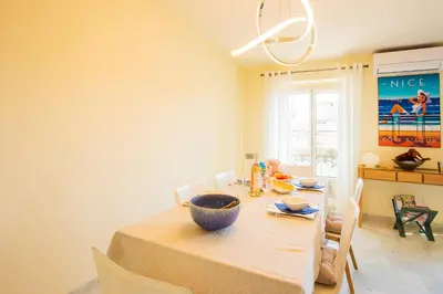 a dining room with a table with a bowl on it at LE FOCH AP4244 By Riviera Holiday Homes in Nice