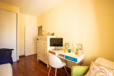 a bedroom with a desk with a computer on it at LE FOCH AP4244 By Riviera Holiday Homes in Nice