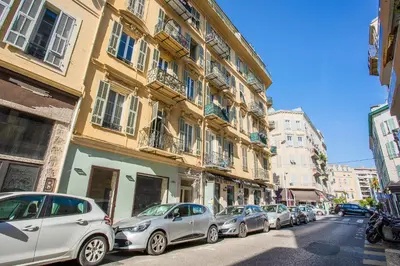a row of cars parked on a city street at LE FOCH AP4244 By Riviera Holiday Homes in Nice
