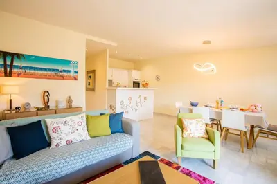 a living room with a couch and a dining room at LE FOCH AP4244 By Riviera Holiday Homes in Nice