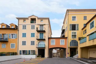 a row of buildings in a parking lot at La Providence in Nice