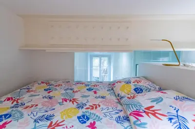a bedroom with a bed with a colorful bedspread at Happyfew Liberty in Nice