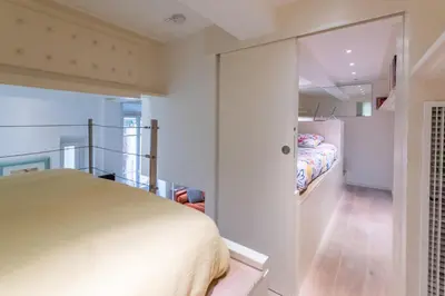 a bedroom with a bed and a walk in closet at Happyfew Liberty in Nice