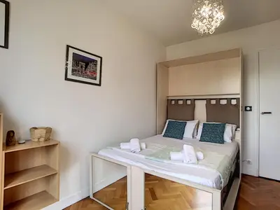 a bedroom with a bed with towels on it at Nestor&Jeeves - ANDRIOLI TERRASSE - Central - Close beach - Top floor in Nice