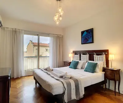a bedroom with a large bed and a large window at Nestor&Jeeves - ANDRIOLI TERRASSE - Central - Close beach - Top floor in Nice