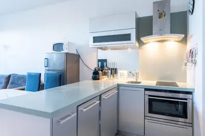 a kitchen with a counter top and a refrigerator at Happyfew Eros in Nice