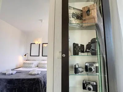 a bedroom with a bed and a room with a camera at Nestor&Jeeves - NOTRE DAME - Hyper center - Top floor - 180 view in Nice