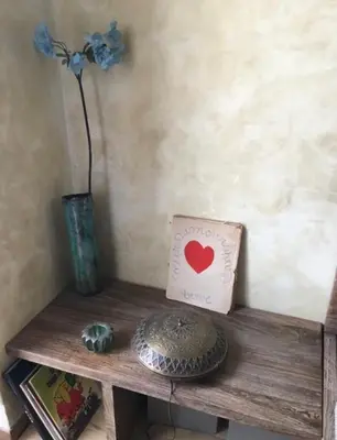 a table with a vase and a card with a heart on it at Great and light private room in the heart of Nice in Nice