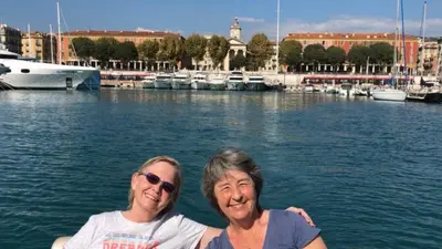 two women posing for a picture in front of a marina at Great and light private room in the heart of Nice in Nice