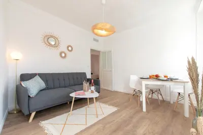 a living room with a couch and a table at Maison Bianchi - Villefranche in Villefranche-sur-Mer