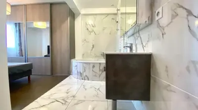 a bathroom with a sink and a tub at L'Avenir du Ray in Nice