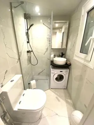 a bathroom with a toilet and a sink and a shower at LE ROCAMARE -Superb-Atypical Sea view-A.C-WIFI in Nice
