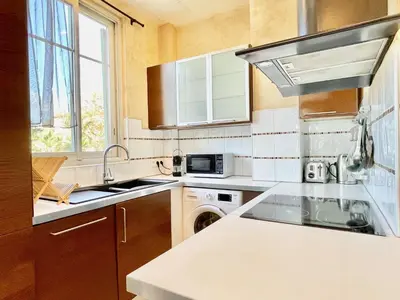 a kitchen with a sink and a stove at Swiss Star - Easy Home Booking in Nice
