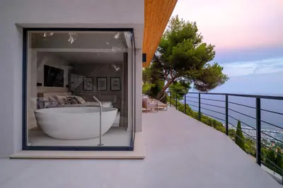 a bath tub on the balcony of a house at Villa Vista Mare by iVillamia com in Villefranche-sur-Mer