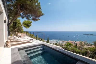 a swimming pool with a view of the ocean at Villa Vista Mare by iVillamia com in Villefranche-sur-Mer