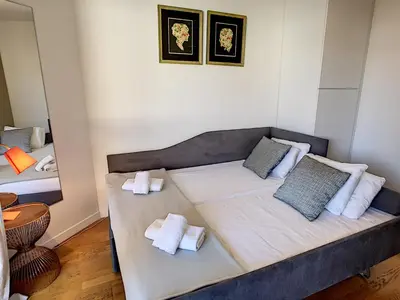 a small room with a bed with towels on it at Nestor&Jeeves - PALAIS MEDITERRANEE TERRASSE - Central - Very close sea in Nice