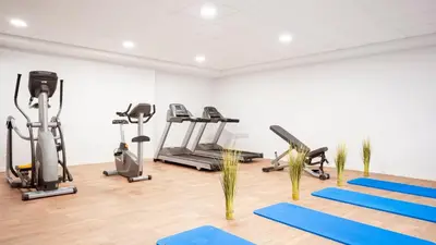 a gym with several treadmills and exercise machines at Residhome Nice Aéroport in Nice