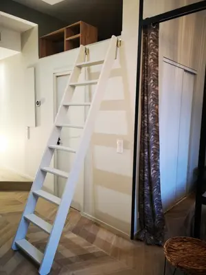 a ladder leading up to a loft bed in a room at A & K luxury appartments Port de Nice Garibaldi in Nice