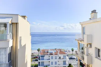 a view of the ocean from a building at Le Béryl in Nice
