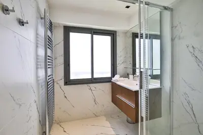 a bathroom with a sink and a mirror at Sublime Appartement Promenade des Anglais (2) in Nice