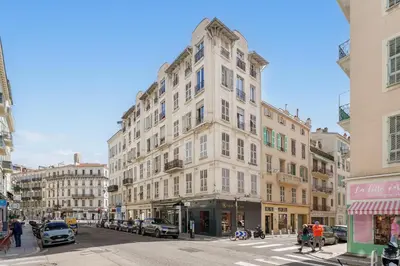 a room with a balcony with a view of a city at Nice Renting - NOTRE DAME - Cosy Loft Perfect View on the roofs in Nice