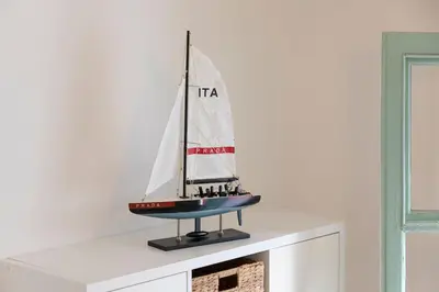 a model of a sailboat sitting on top of a shelf at On Board Captain in Nice