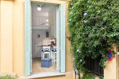 an open door to a kitchen with a balcony at On Board Captain in Nice