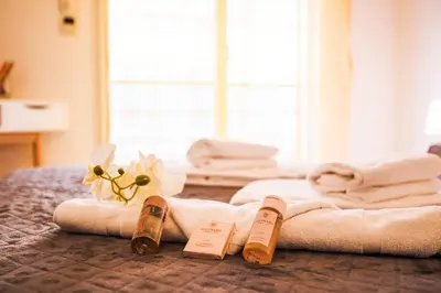 a hotel room with towels and wine bottles on a bed at PALAIS LIBERTE 4 AP4253 By Riviera Holiday Homes in Nice