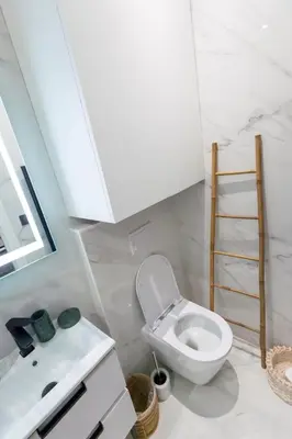 a bathroom with a white toilet and a sink at Superbe studio Plage/Promenade des Anglais 105 in Nice