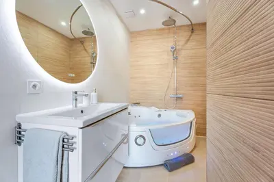 a bathroom with a sink and a mirror at Elegant Jacuzzi Loft in Central Massena in Nice