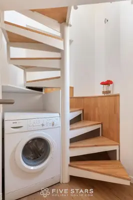 a laundry room with a washer and dryer at Studio Fleur FSHH in Nice