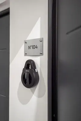 a black door knob on a white wall at Superbe studio Plage/ Promenade des Anglais 104 in Nice