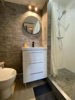 a bathroom with a sink and a toilet and a mirror at Lovely 1 Bedroom Apartment - Heart of Nice in Nice