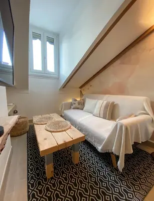 a living room with a couch and a table at Lovely 1 Bedroom Apartment - Heart of Nice in Nice