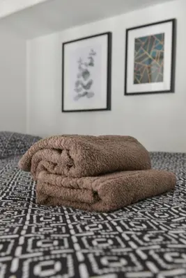 a brown towel laying on the floor in a room at Mer et Soleil - Carré d'or - 4 piéces - Centre ville - Plages à 300 m in Nice