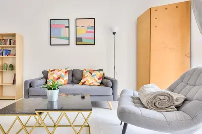 a living room with two chairs and a coffee table at Mer et Soleil - Carré d'or - 4 piéces - Centre ville - Plages à 300 m in Nice