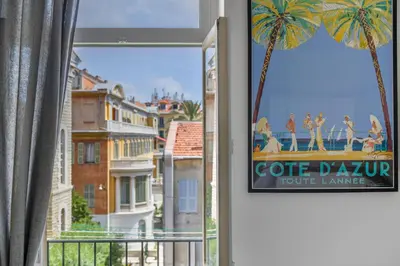 a sign in a window with a view of a city at Mer et Soleil - Carré d'or - 4 piéces - Centre ville - Plages à 300 m in Nice