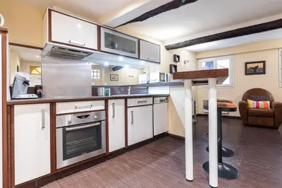 a kitchen with white cabinets and a stove at Atypical Cozy 1 Bdr Old Town in Nice