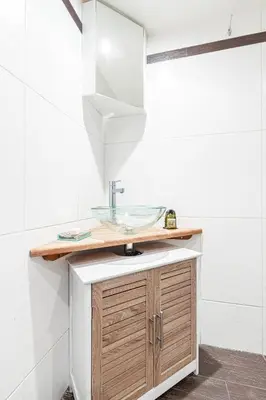 a bathroom with a sink and a glass counter at Atypical Cozy 1 Bdr Old Town in Nice