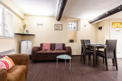 a living room with a couch and a table at Atypical Cozy 1 Bdr Old Town in Nice